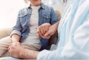 A man and woman holding hands in front of another person.