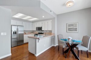 A beautiful kitchen with white beautiful cabinets
