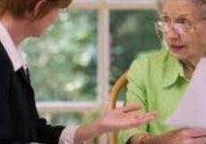 Two women engaged in a serious conversation at a table. Two women engaged in a serious conversation at a table.